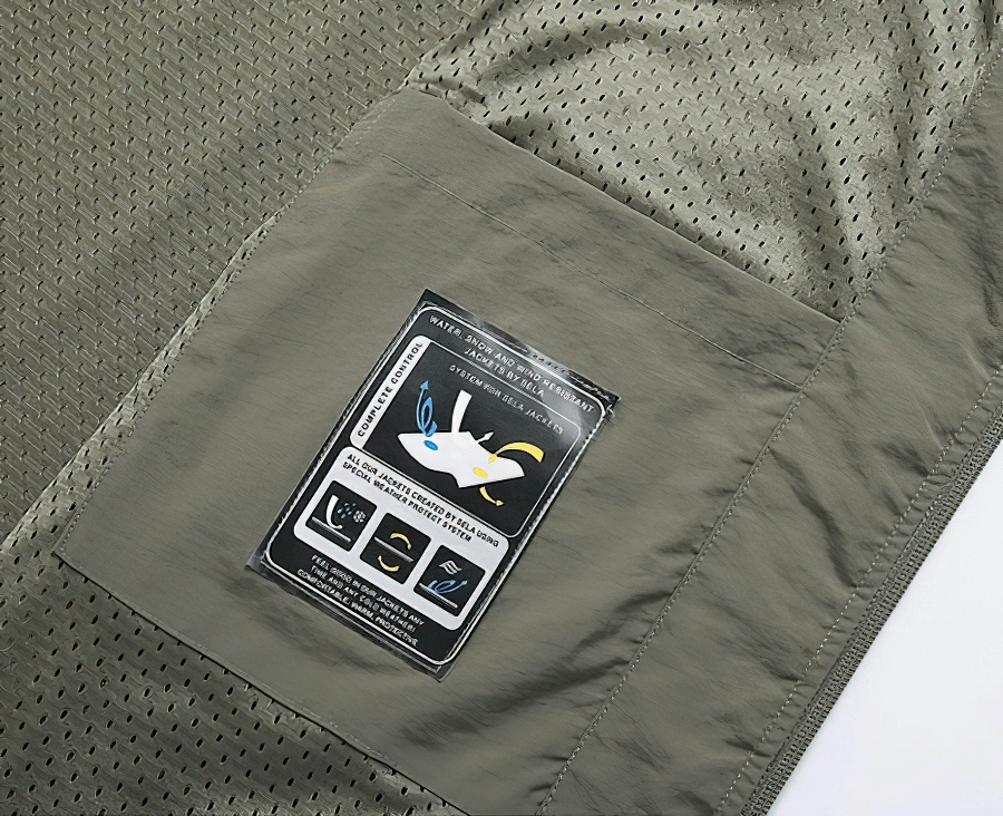 Detail view of Casual Stand Collar Zipper Travels Vest pocket and label, featuring breathable mesh fabric with solid pattern.